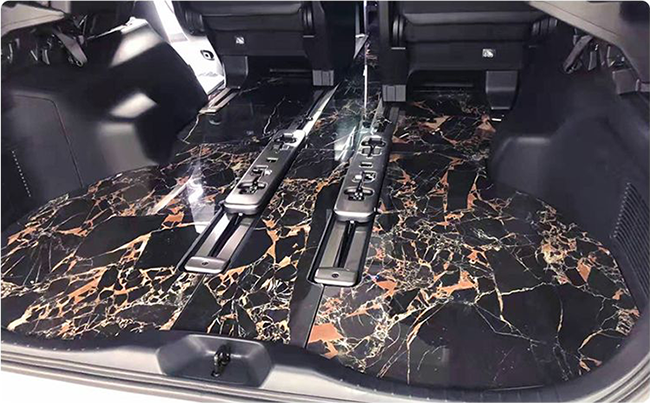 The effect of Toyota Alphard after installing the marble floor with black and gold flower pattern